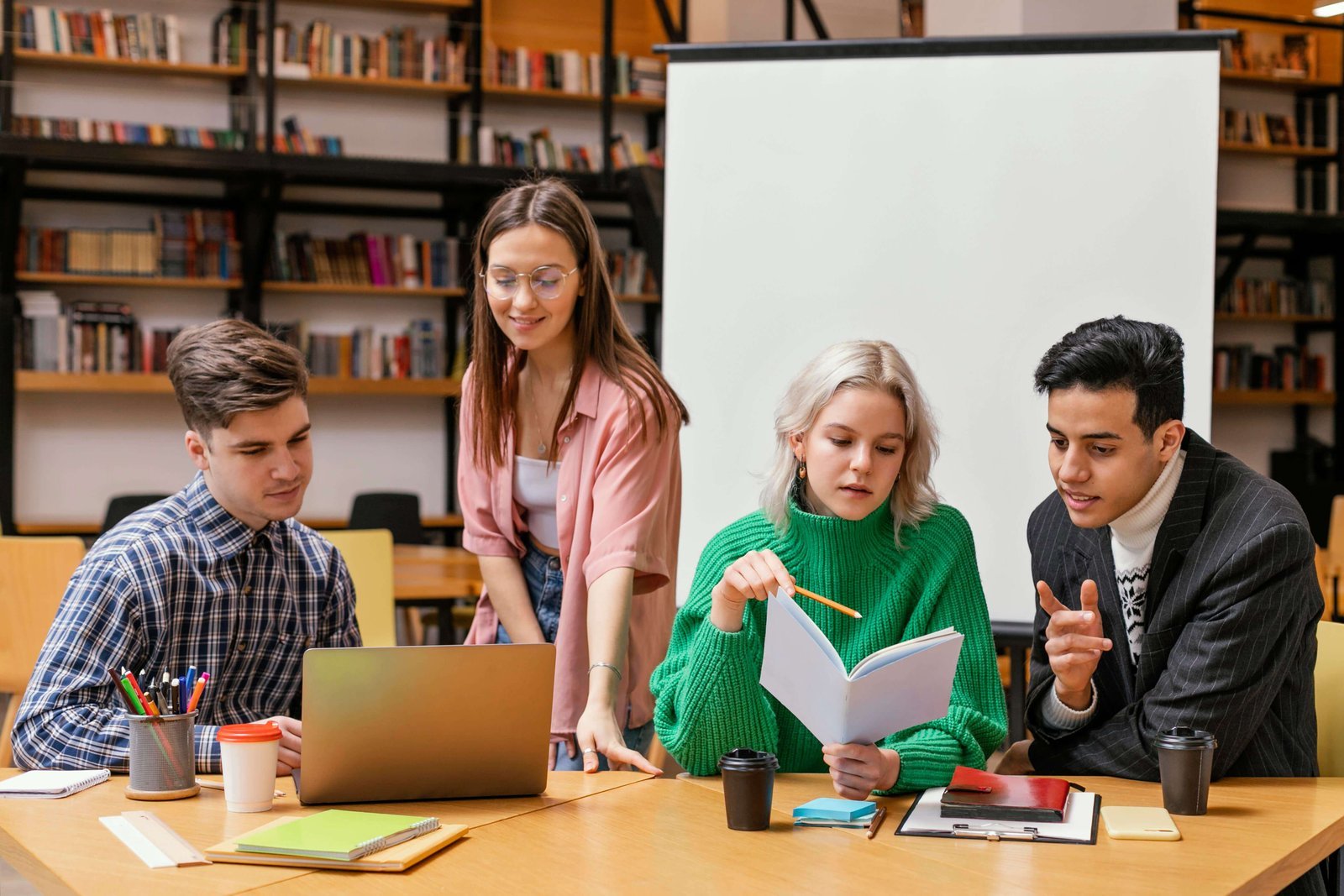 Adult learners sharing ideas around a study table